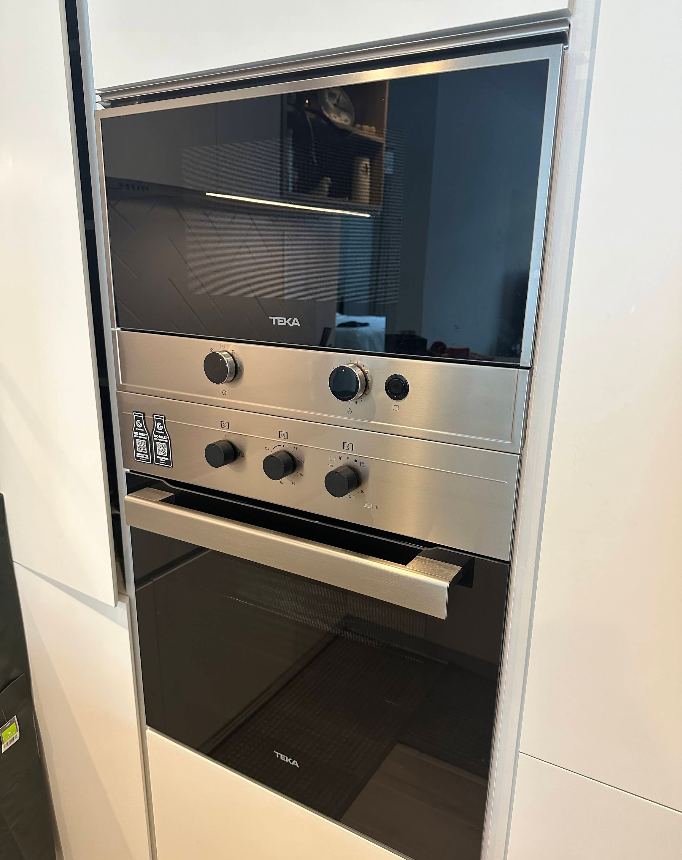 Technician repairing a built-in double oven