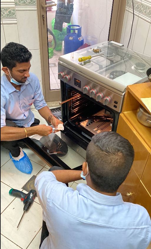 Technician diagnosing an appliance fault on site
